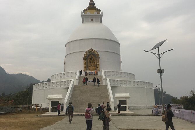 Entire Day Pokhara Complete Tour - Peace Stupa access road at sunset: Pokhara’s view from a temple site